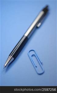 Close-up of a pen and a paper clip