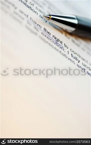 Close-up of a pen on a printed document