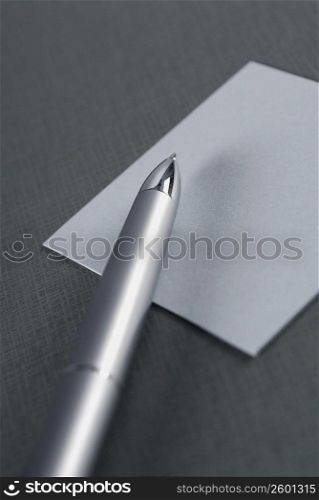 Close-up of a pen on a sheet of paper