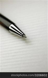 Close-up of a pen on a table cloth