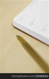 Close-up of a pen with a diary