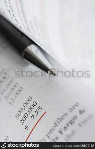 Close-up of a pen with a document