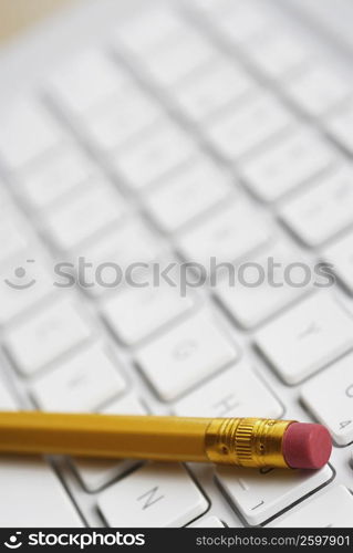 Close-up of a pencil on a laptop&acute;s keyboard