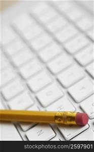 Close-up of a pencil on a laptop&acute;s keyboard