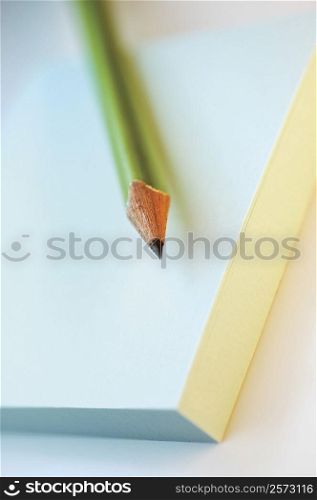 Close-up of a pencil on a notepad