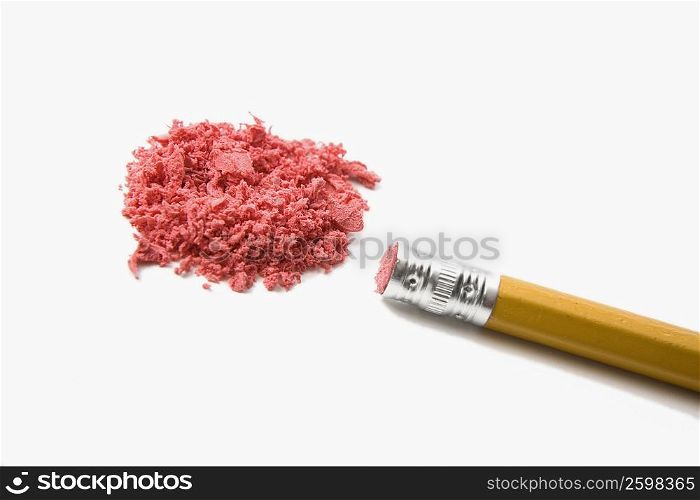 Close-up of a pencil with a heap of pieces of eraser