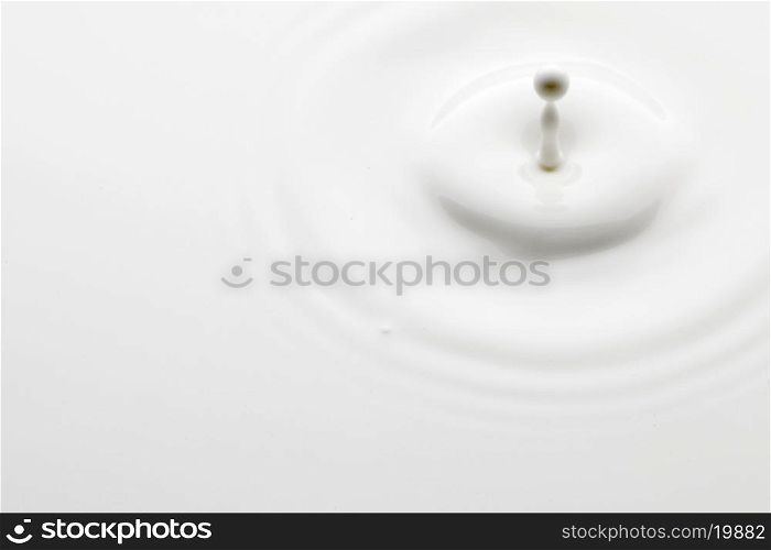 Close-up of a perfect minimalistic milk splash. Milk splash