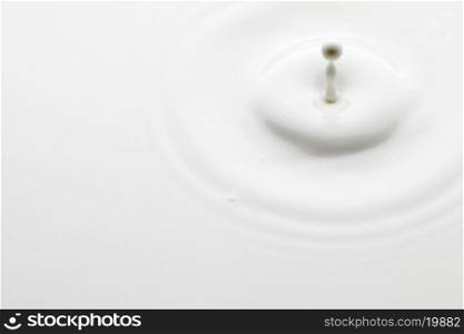 Close-up of a perfect minimalistic milk splash. Milk splash