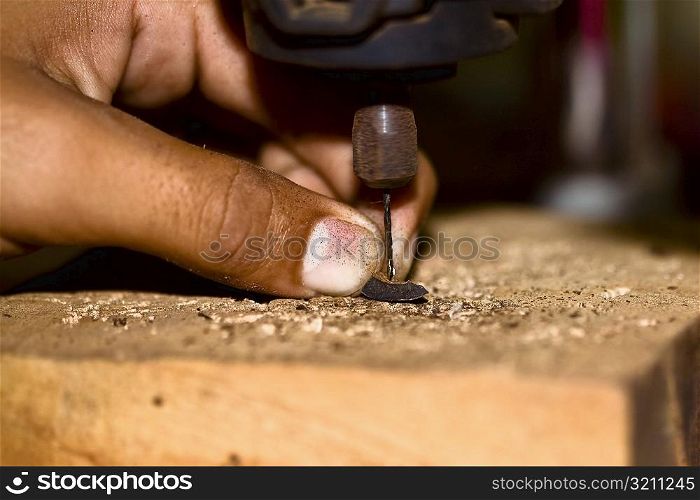 Close-up of a person&acute;s finger drilling, Izamal, Yucatan, Mexico