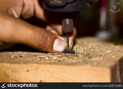Close-up of a person&acute;s finger drilling, Izamal, Yucatan, Mexico