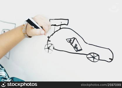 Close-up of a person&acute;s hand drawing a sketch