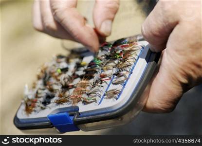 Close-up of a person&acute;s hand holding a fly box