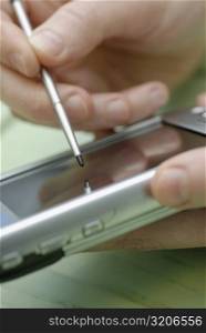 Close-up of a person&acute;s hand operating a mobile phone