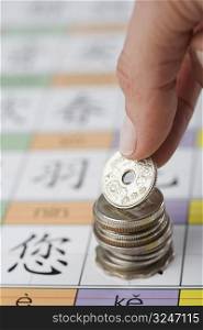Close-up of a person&acute;s hand putting coin