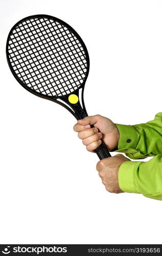 Close-up of a person&acute;s hands holding a tennis racket