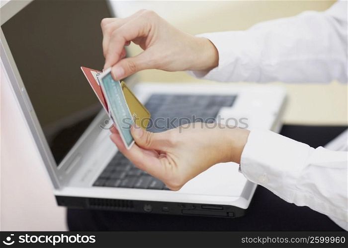 Close-up of a person&acute;s hands holding credit cards