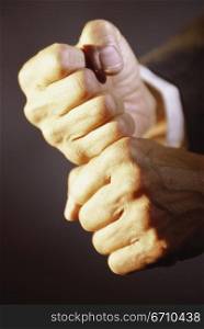 Close-up of a person&acute;s hands making a fist