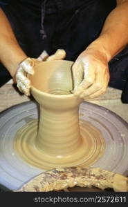 Close-up of a person&acute;s hands making a vase on a potter wheel, Tokushima, Shikoku, Japan