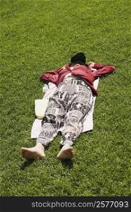 Close-up of a person resting in a lawn
