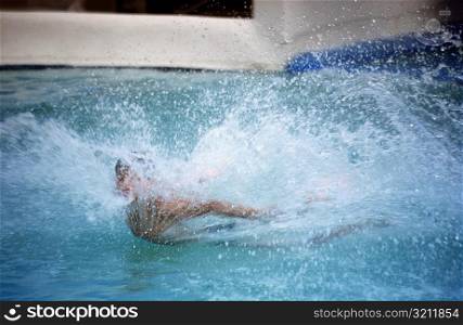 Close-up of a person splashing water in a swimming pool