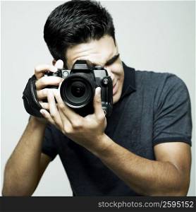 Close-up of a photographer taking a photograph