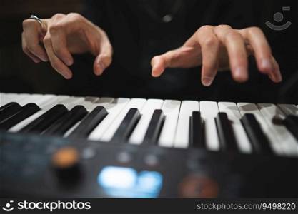 close-up of a pianist’s hands while playing the piano