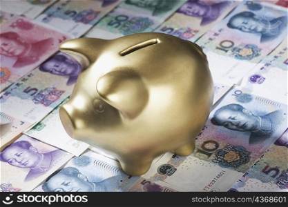Close-up of a piggy bank on paper currency
