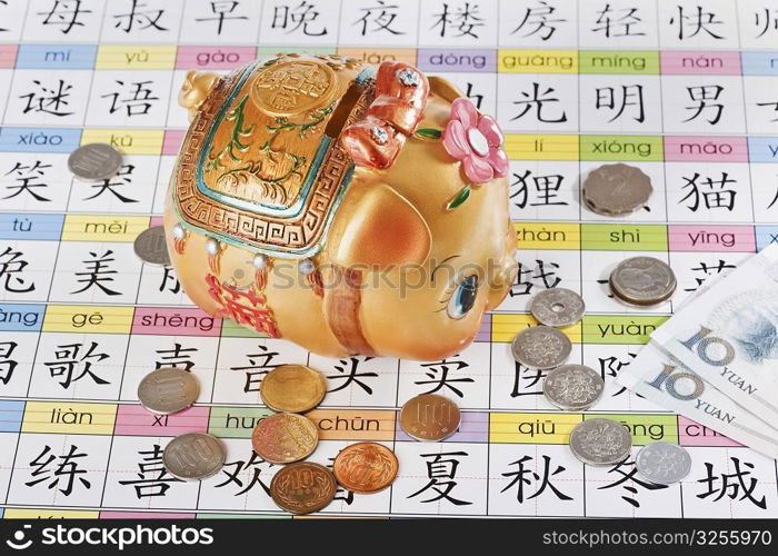 Close-up of a piggy bank with Chinese currency