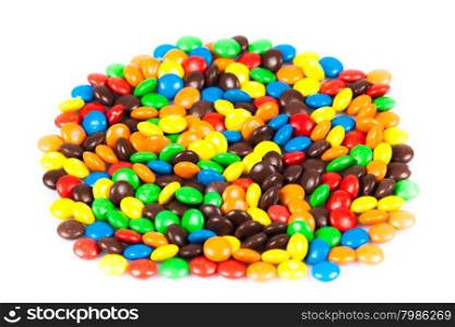 Close up of a pile of colorful chocolate coated candy . color candy