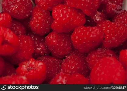 Close up of a pile of raspberries
