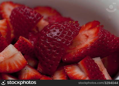 Close up of a pile of sliced red strawberries