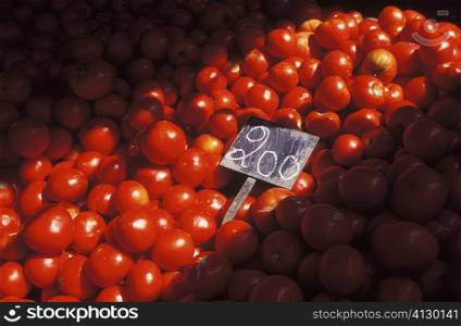 Close-up of a price tag on a heap of tomatoes