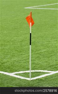 Close-up of a red flag on a football pitch