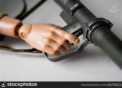 Close-up of a robot&acute;s hand holding a gun