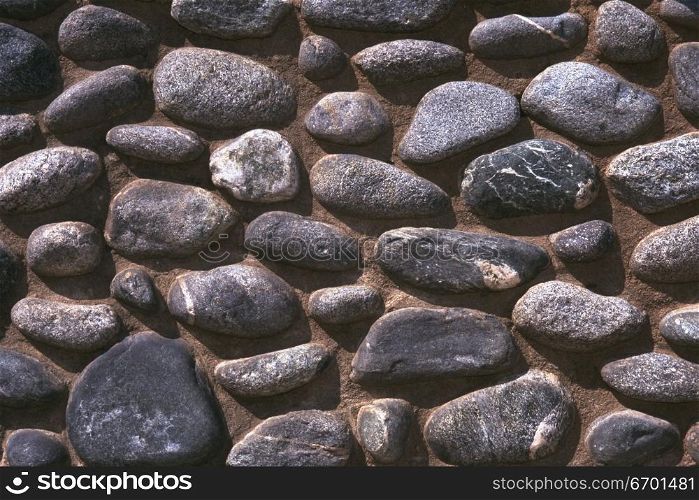 Close-up of a rocks embedded in a wall