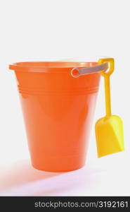 Close-up of a sand pail and a shovel