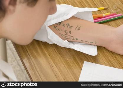 Close-up of a schoolboy copying in an examination