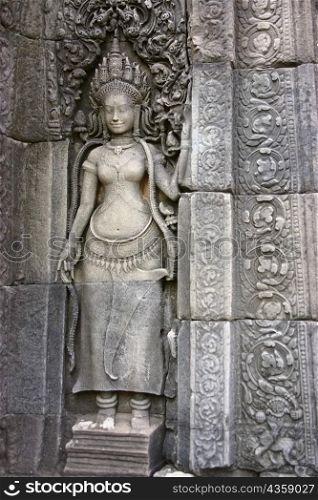 Close-up of a sculpture carved on the wall of a temple, Angkor Wat, Siem Reap, Cambodia