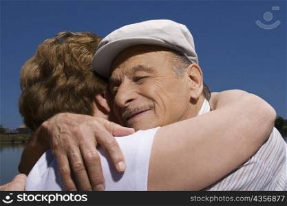 Close-up of a senior couple embracing each other