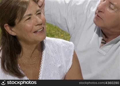 Close-up of a senior couple sitting in a park