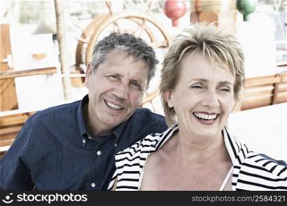 Close-up of a senior man and a mature woman smiling