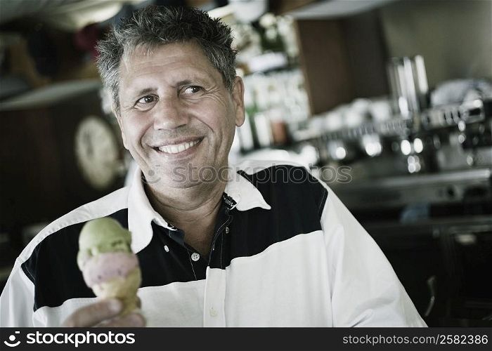 Close-up of a senior man holding an ice-cream