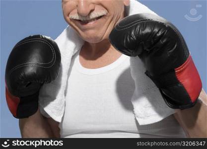 Close-up of a senior man in boxing pose