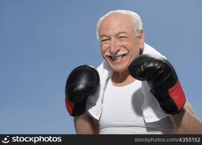 Close-up of a senior man in boxing pose
