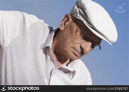 Close-up of a senior man wearing a flat cap
