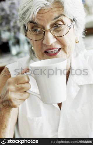 Close-up of a senior woman holding a cup of tea
