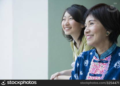 Close-up of a senior woman smiling with her granddaughter