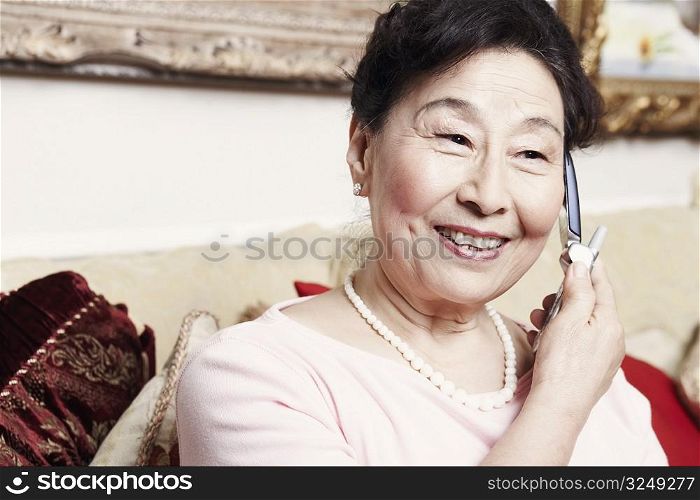 Close-up of a senior woman talking on a mobile phone
