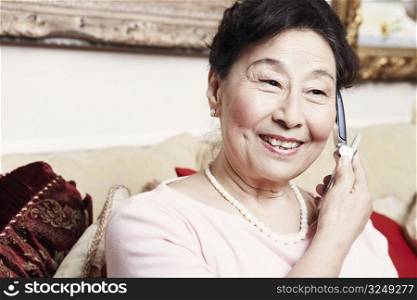 Close-up of a senior woman talking on a mobile phone