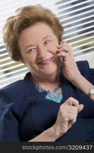 Close-up of a senior woman talking on a mobile phone and smiling